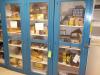 3 door wood and glass cabinet with contents.  Including square d, Allen Bradley, and Siemens